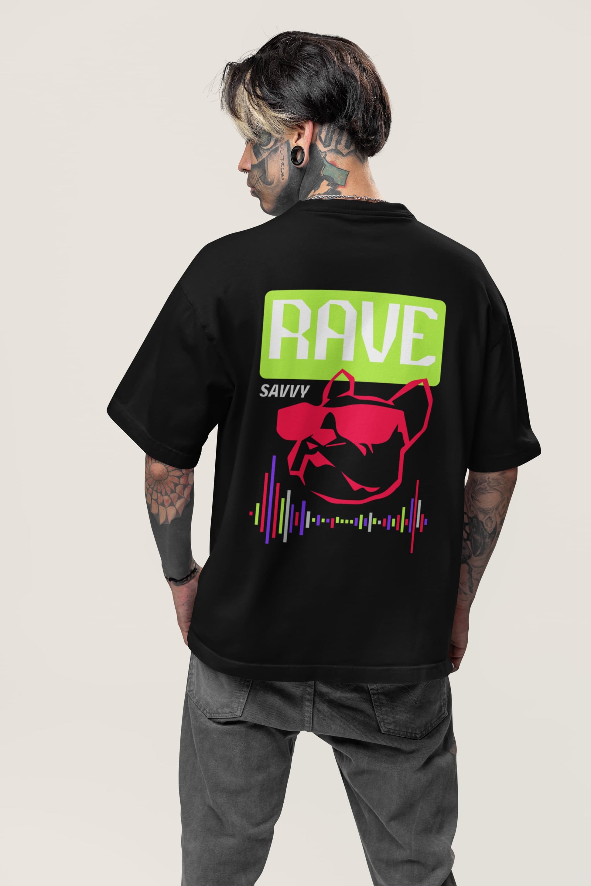 back view mock up fo a man with face tattoos wearing a black T-shirt with Rave Savvy written on it